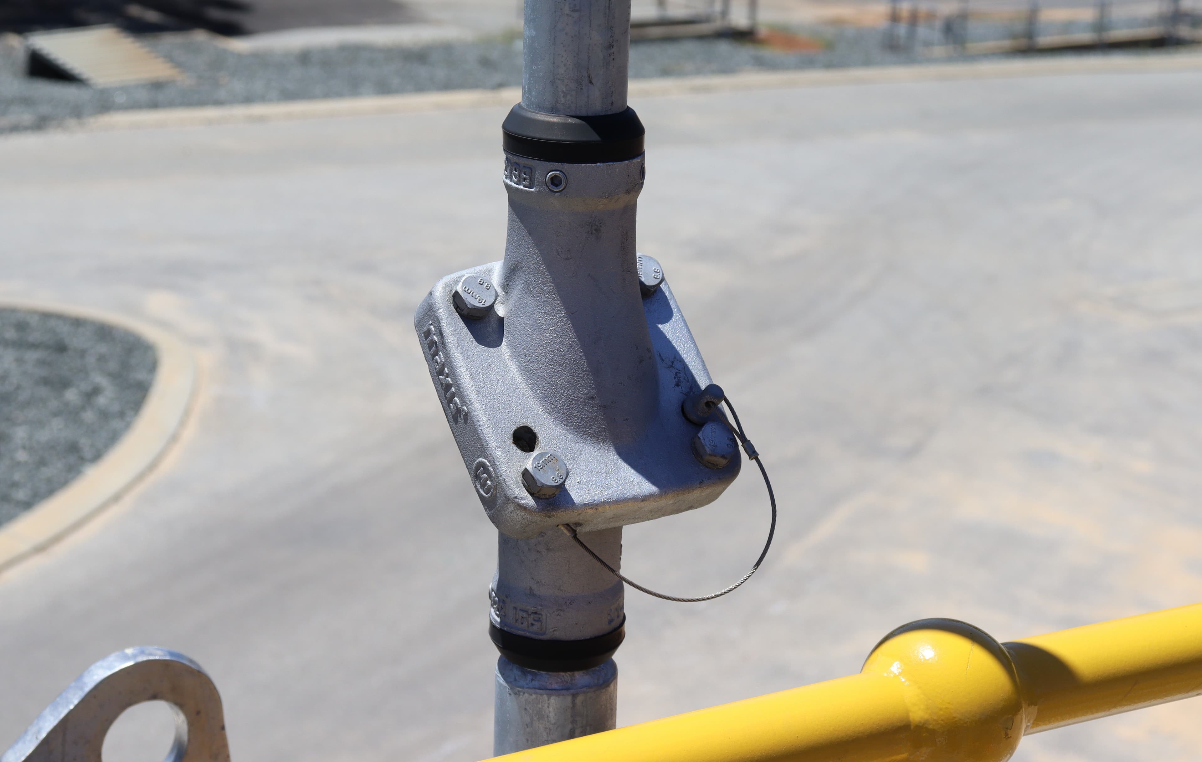 Close-up of a Swivelpole™ Maxis™ lowering system joint showing retained fasteners and positive mechanical locking features